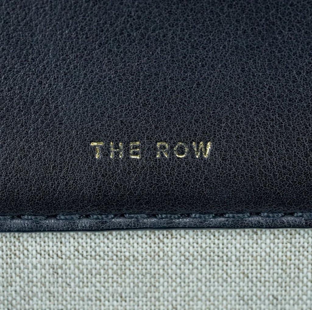 THE ROW Margaux 15 Canvas and Leather Handbag in Black and Beige