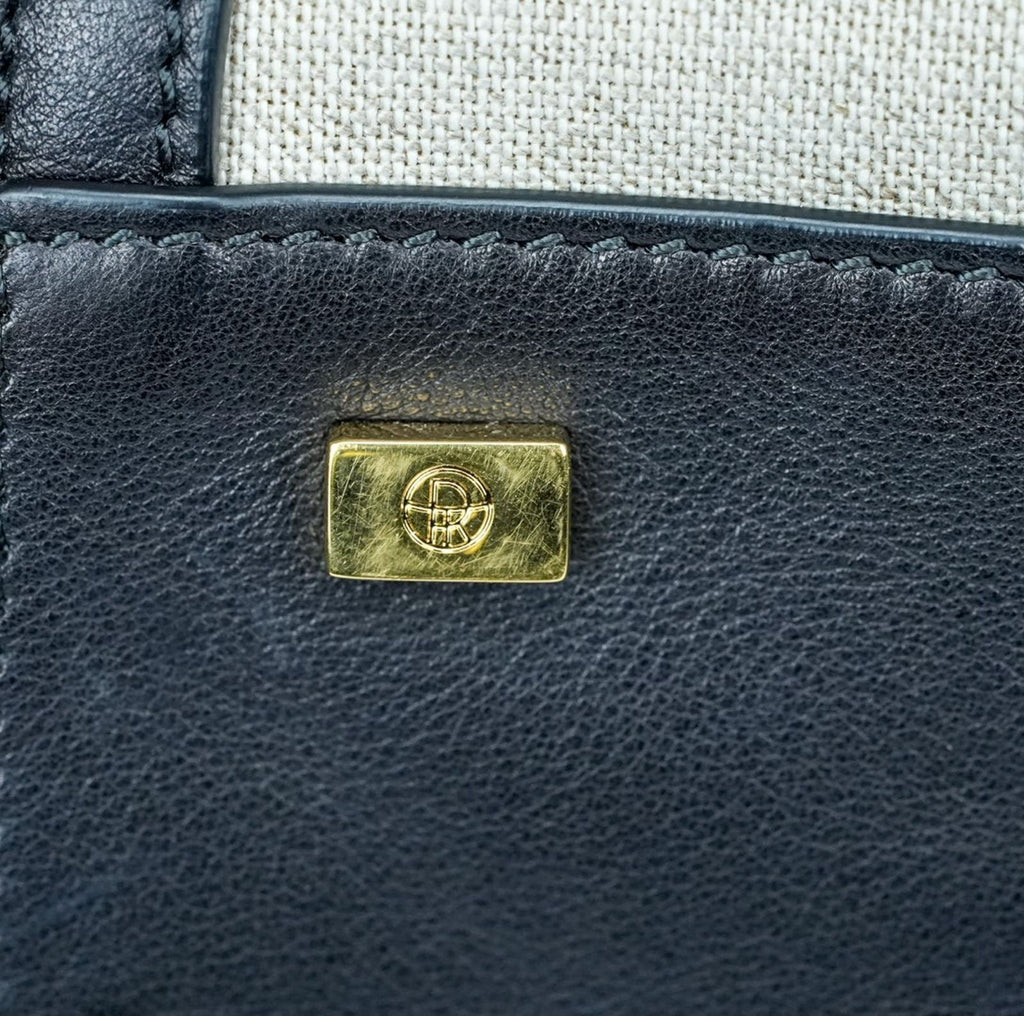 THE ROW Margaux 15 Canvas and Leather Handbag in Black and Beige