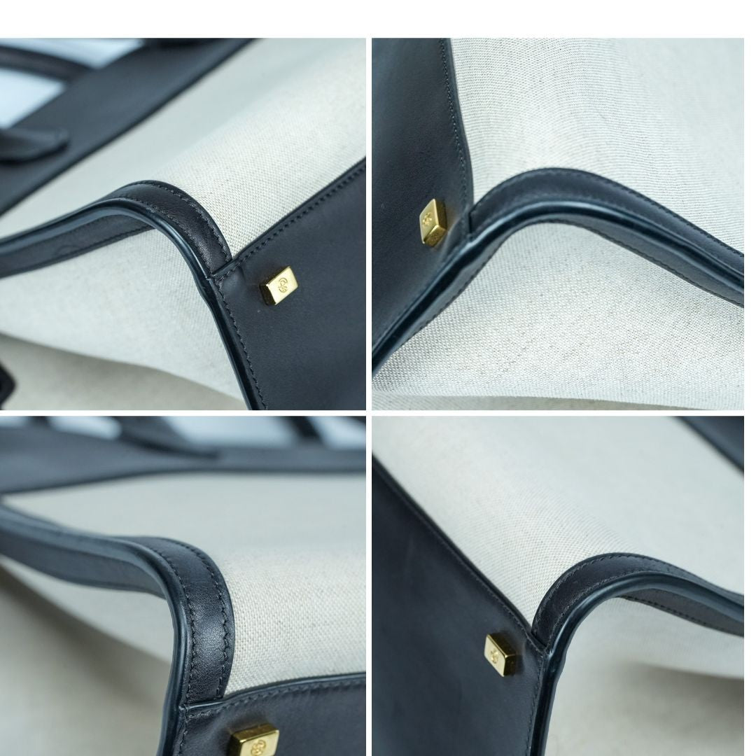 THE ROW Margaux 15 Canvas and Leather Handbag in Black and Beige