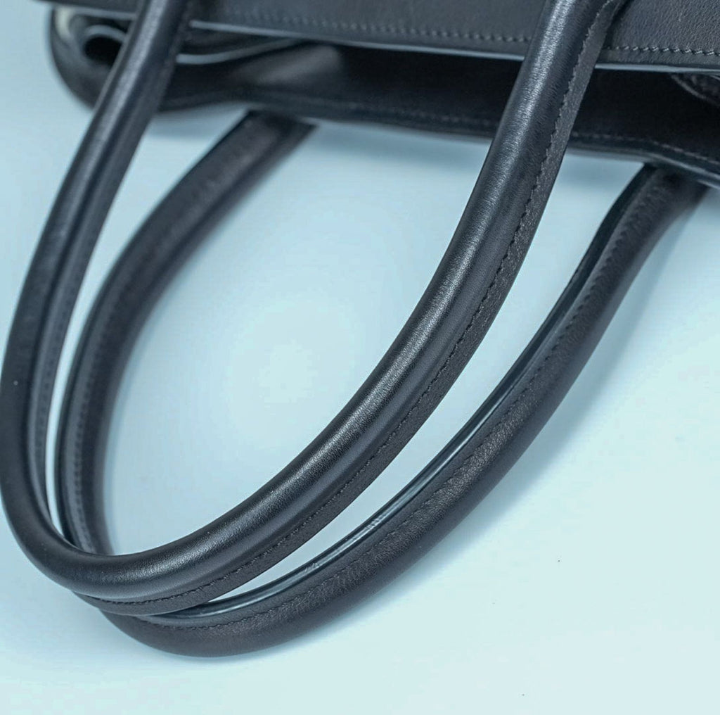 THE ROW Margaux 15 Canvas and Leather Handbag in Black and Beige