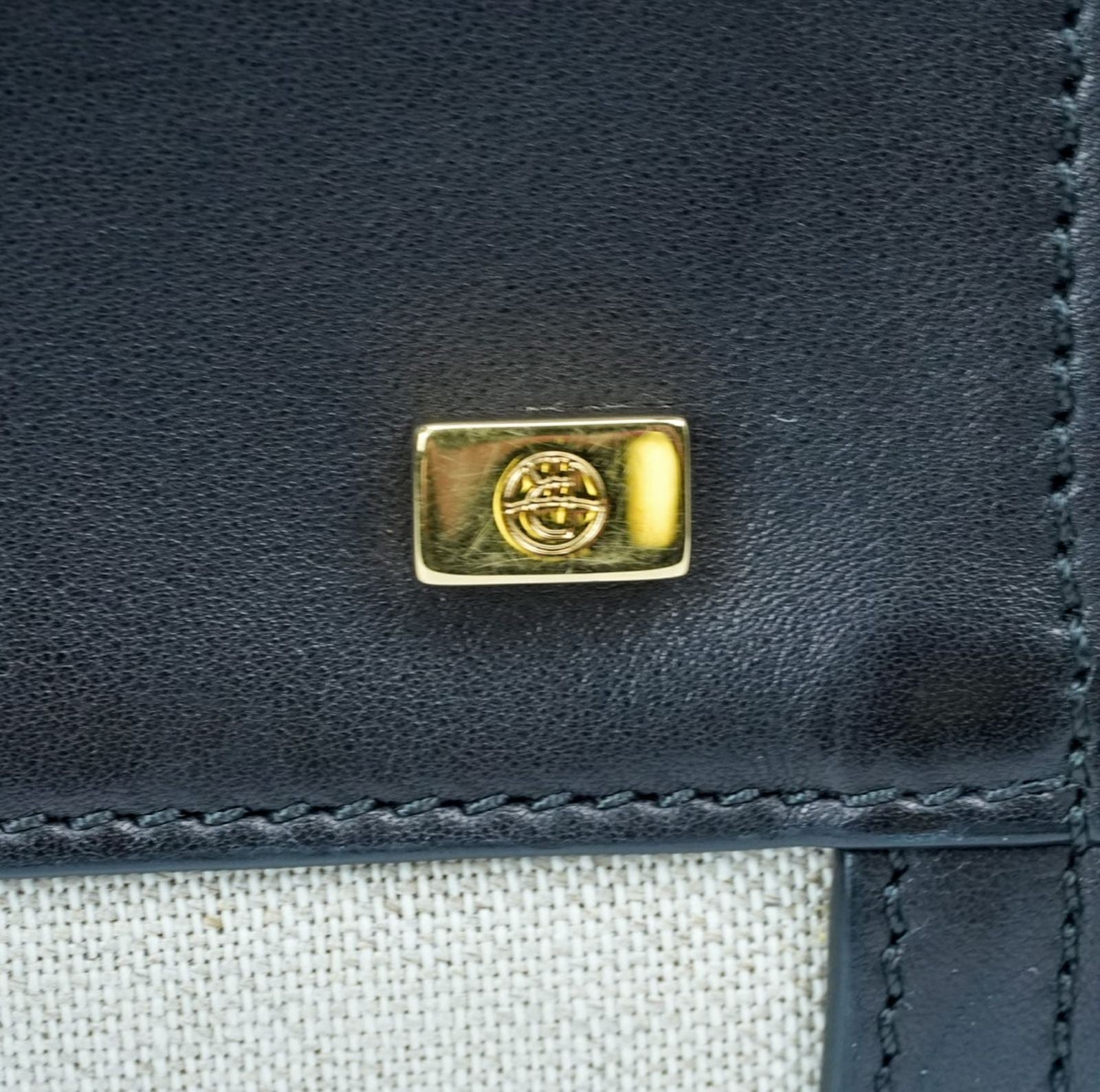 THE ROW Margaux 15 Canvas and Leather Handbag in Black and Beige