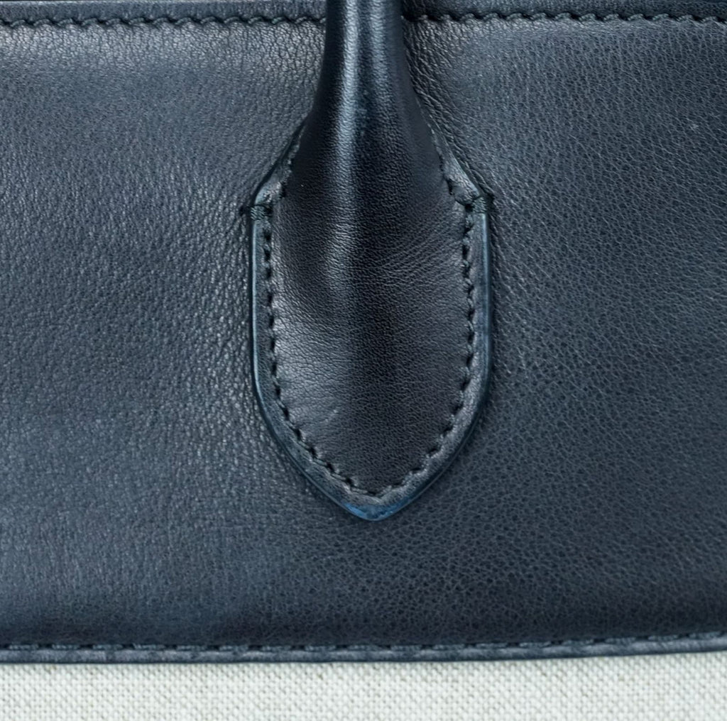 THE ROW Margaux 15 Canvas and Leather Handbag in Black and Beige
