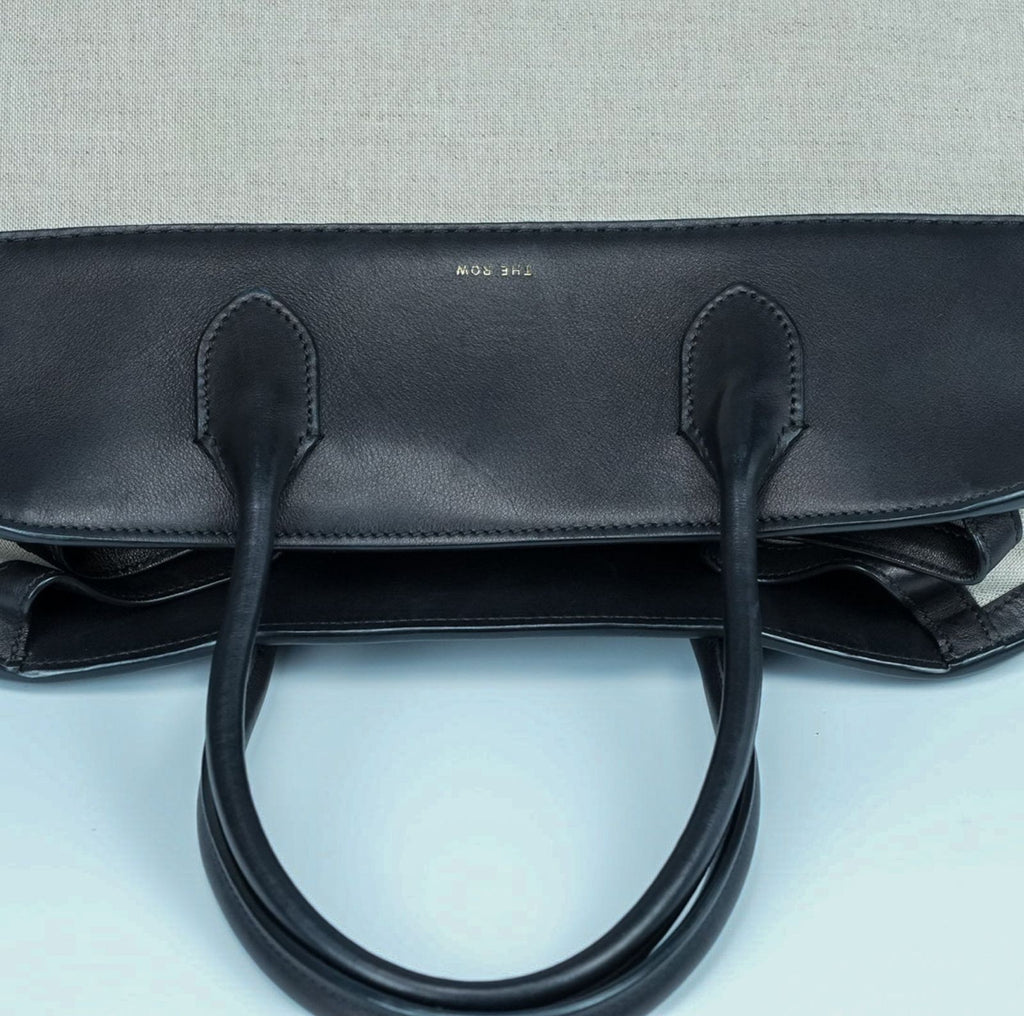 THE ROW Margaux 15 Canvas and Leather Handbag in Black and Beige