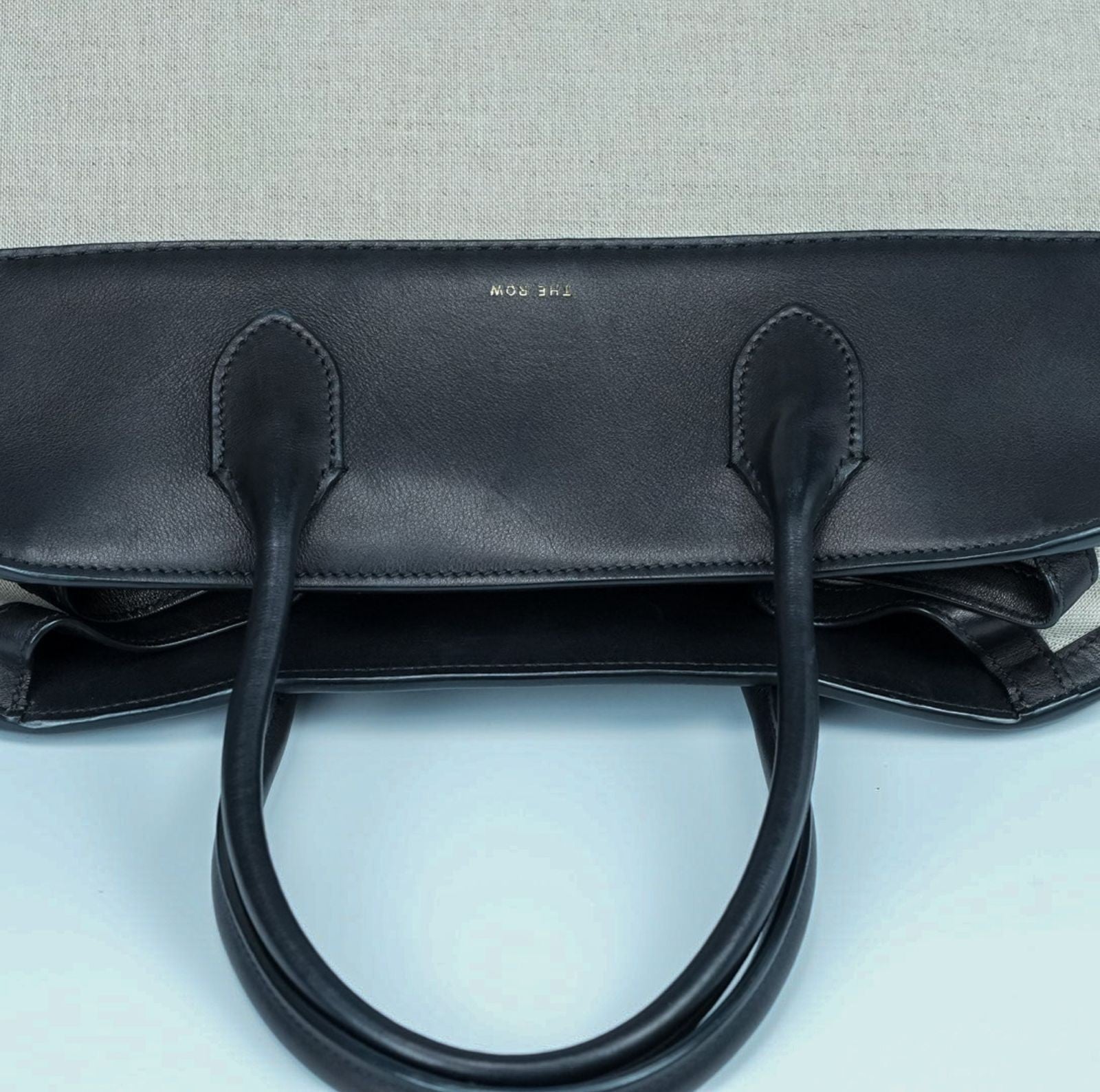 THE ROW Margaux 15 Canvas and Leather Handbag in Black and Beige