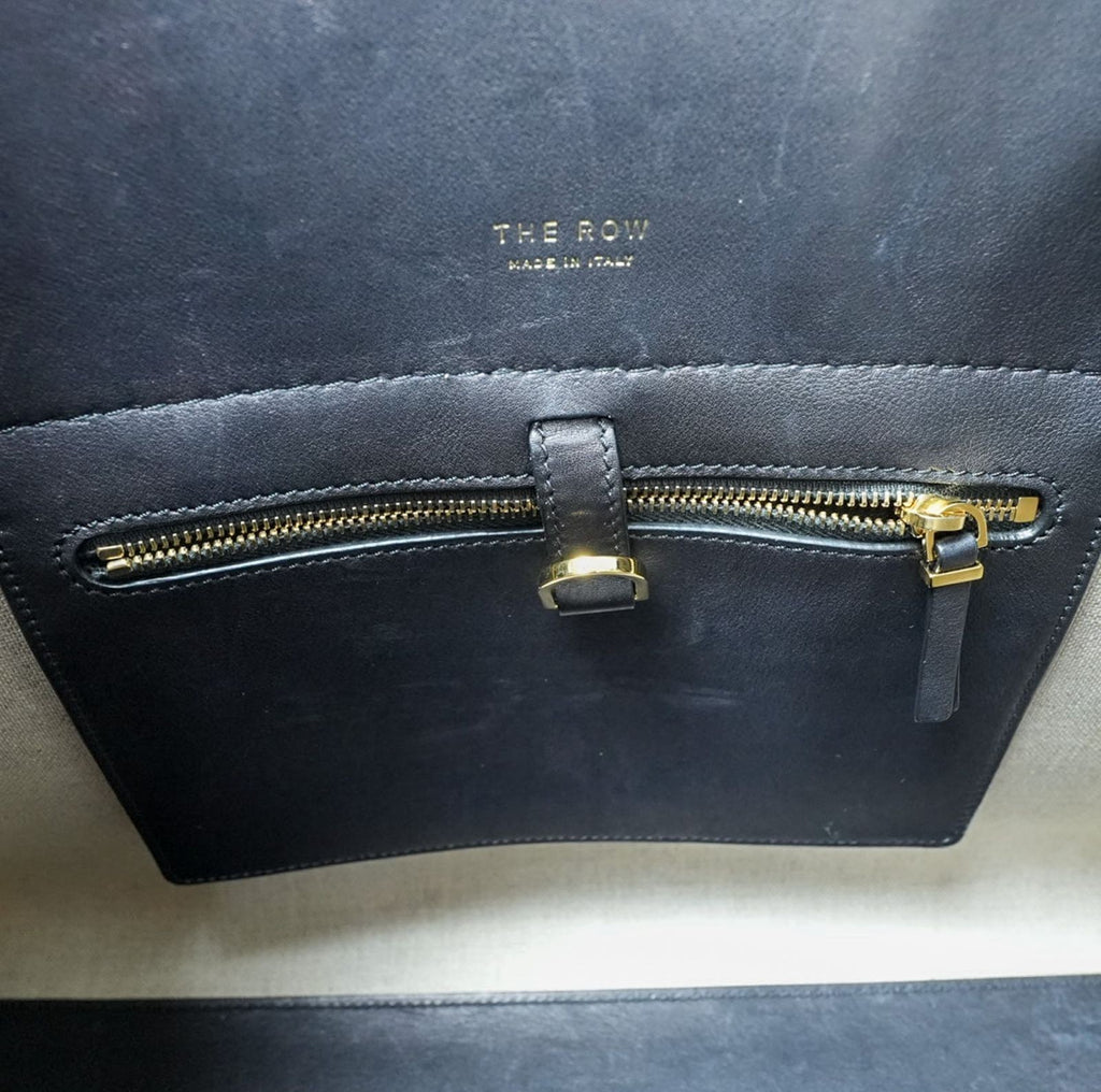 THE ROW Margaux 15 Canvas and Leather Handbag in Black and Beige